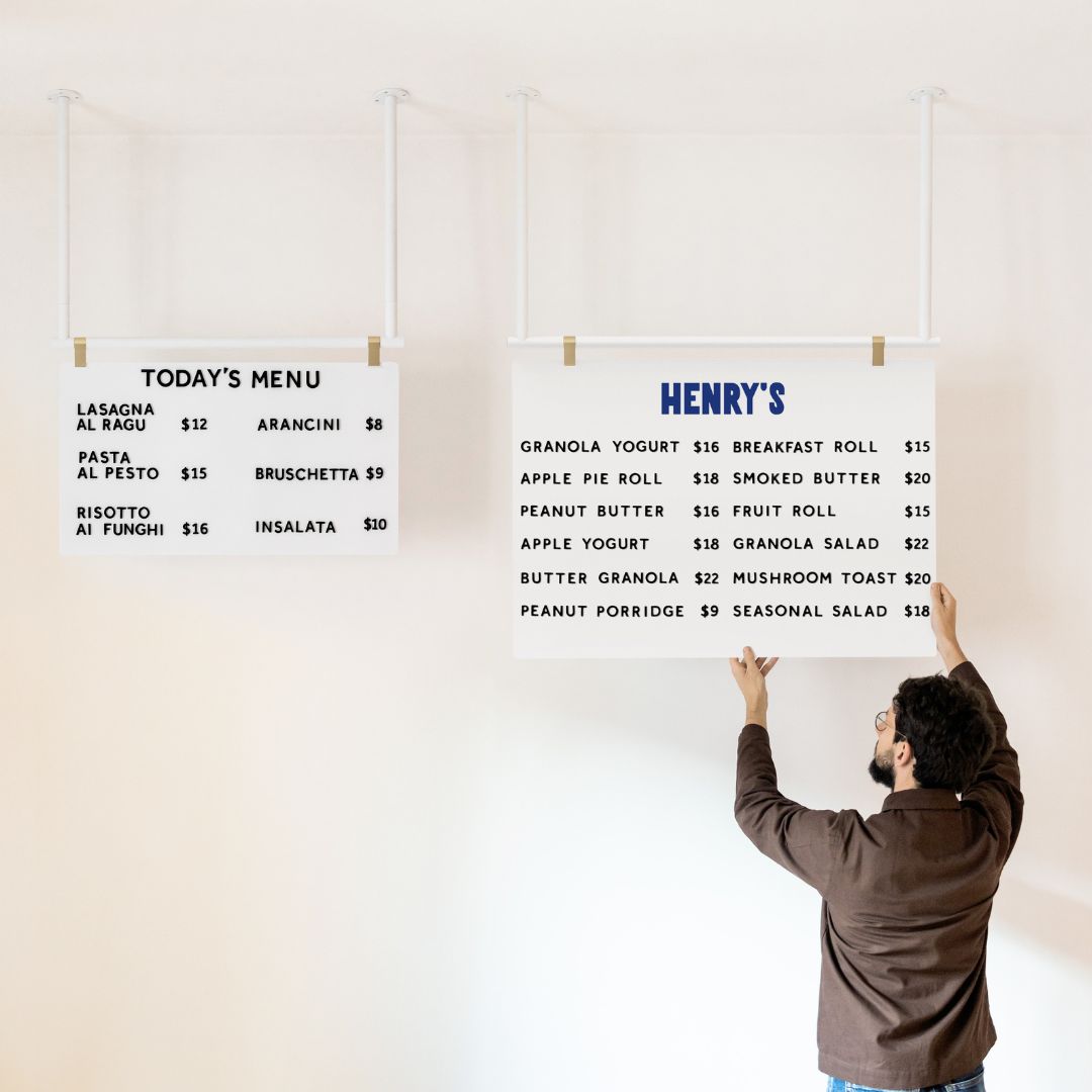 white magnetic cafe menu displays hanging from ceiling