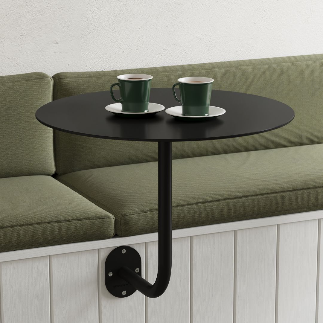 larger-sized black wall-mounted coffee table holding coffees