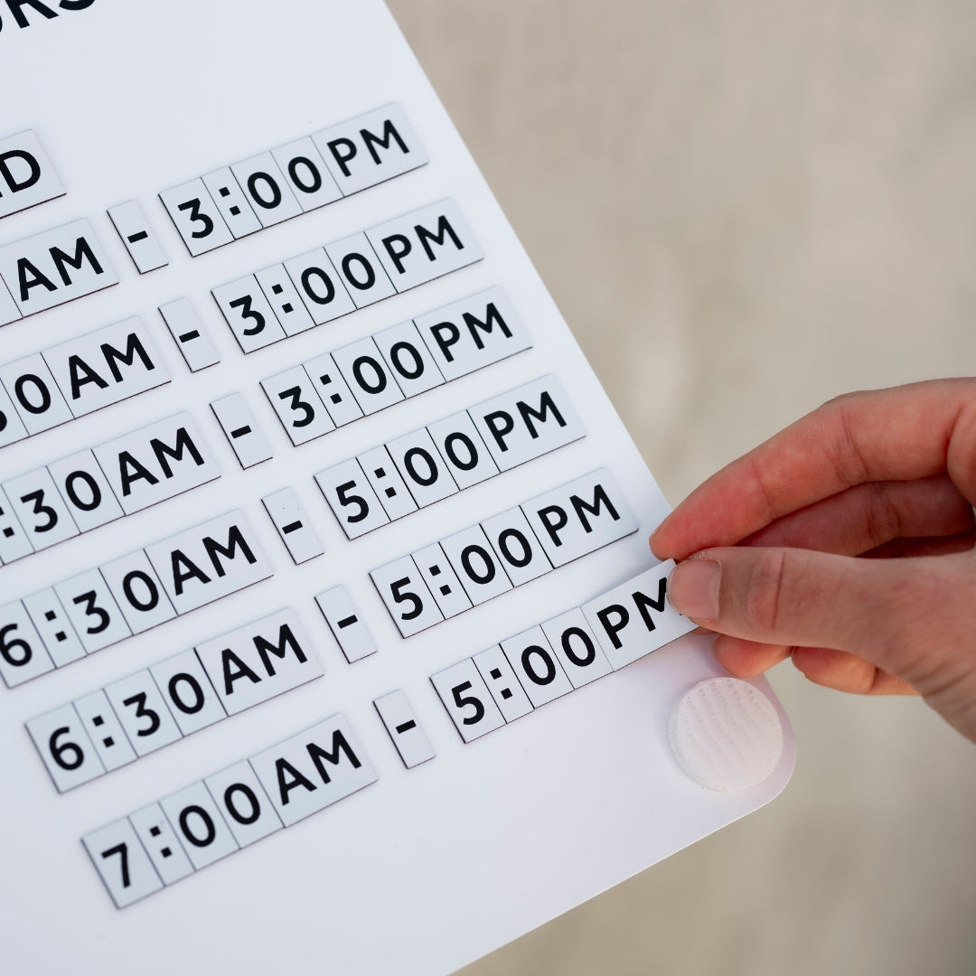 Magnetic letter opening hours sign