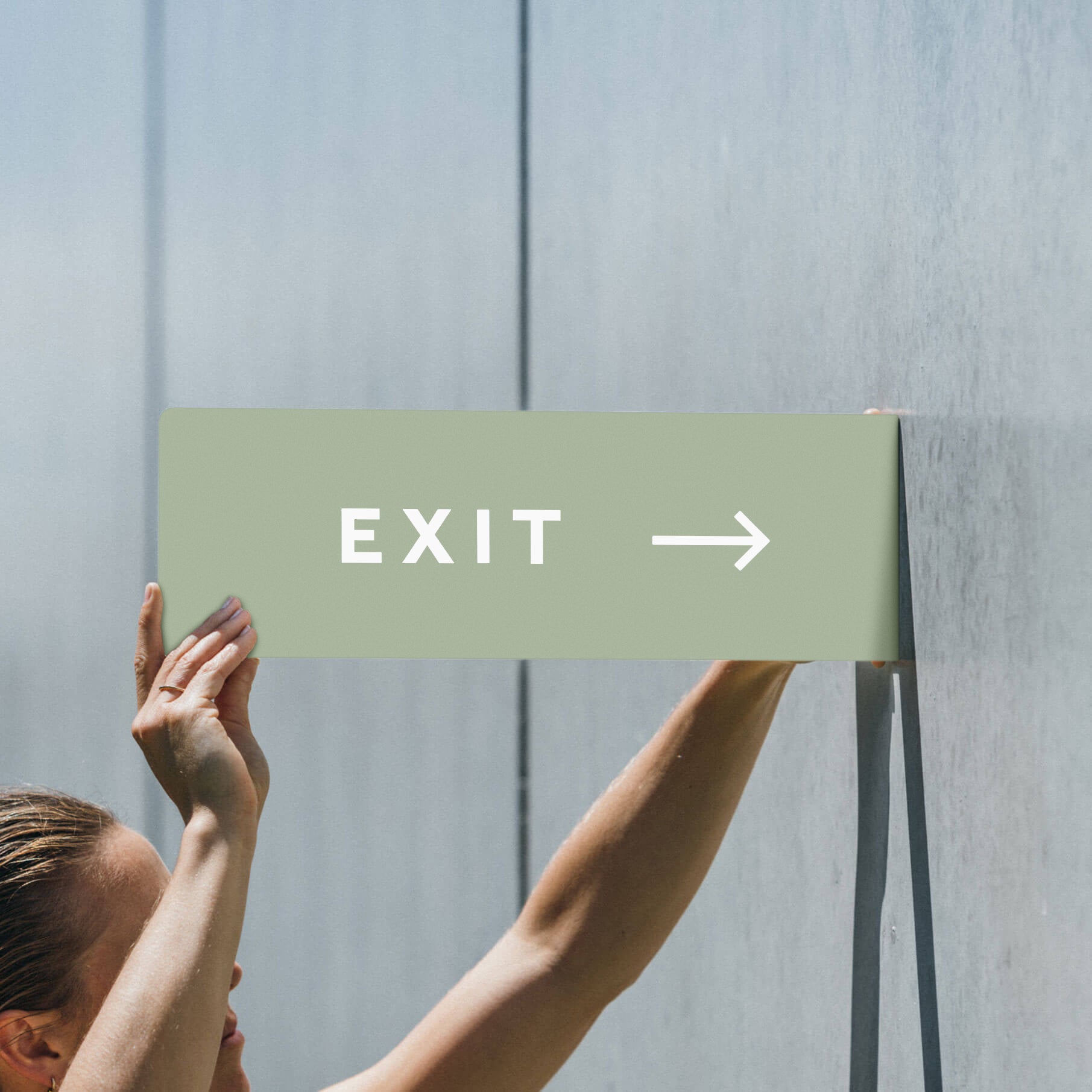 sage colored exit guide sign