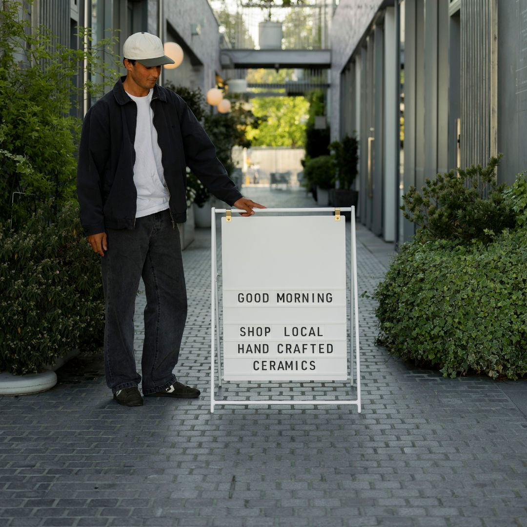 Custom interchangeable letter a-frame sandwich board sign in alleyway