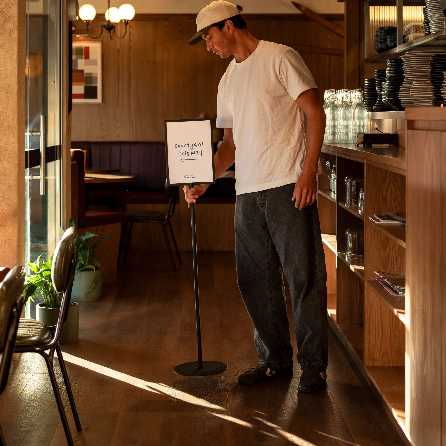 custom wayfinding sign holder indoors with person